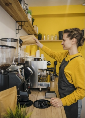 side-view-female-barista-grinding-coffee